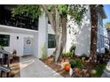 Condo entrance with walkway and autumnal decorations at 1901 Oyster Catcher Ln # 814, Clearwater, FL 33762