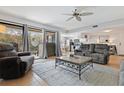 Spacious living room with gray sofas and a coffee table at 19725 Gulf Blvd # 20, Indian Shores, FL 33785
