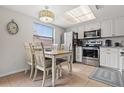 Bright kitchen with stainless steel appliances and white cabinets at 19725 Gulf Blvd # 20, Indian Shores, FL 33785