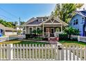 Quaint gray house with a white picket fence at 615 Grove N St, St Petersburg, FL 33701