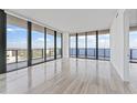 Bright living room with floor to ceiling windows and stunning water views at 2912 W Santiago St # 1901, Tampa, FL 33629