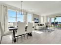 Bright dining room with large windows and stylish dining set at 31873 Anchor Point Dr, Wesley Chapel, FL 33545