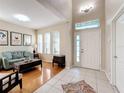 Bright living room with hardwood floors, light walls, and comfortable seating at 5009 Clover Mist Dr, Apollo Beach, FL 33572