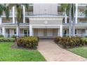 Well-maintained condo building entrance and landscaping at 7296 Marathon Dr # 603, Seminole, FL 33777