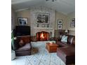 Cozy living room features a brick fireplace at 4739 114Th N St, St Petersburg, FL 33708