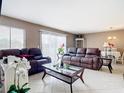 Relaxing living room featuring comfortable leather furniture at 7518 Lyncrest St, North Port, FL 34287