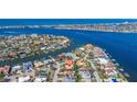 A neighborhood situated on the water featuring numerous homes with docks and boats at 165 4Th N Ave, Tierra Verde, FL 33715