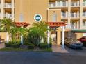 Building entrance with pergola and landscaping at 6495 Shoreline Dr # 8502, St Petersburg, FL 33708