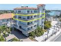 Multi-unit building showcasing a desirable second floor unit with balconies at 10133 Gulf Blvd # E3, Treasure Island, FL 33706