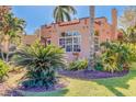 Side view of Spanish-style home with tropical landscaping at 114 19Th Ne Ave, St Petersburg, FL 33704