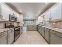 Modern kitchen with stainless steel appliances and granite countertops at 10520 Collar Dr, San Antonio, FL 33576