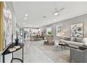 Open living room and kitchen with modern finishes and lots of natural light at 2921 Sanchez St, Tampa, FL 33605