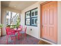 Inviting front porch with a cozy seating area and a welcoming entrance to the beautiful townhome at 5902 Yeats Manor Dr, Tampa, FL 33616