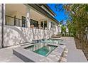 Luxury pool and spa with stone coping and decking at 5104 W Evelyn Dr, Tampa, FL 33609