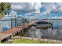 Community boat dock with several boats and access to the lake at 90 S Highland Ave # 1115, Tarpon Springs, FL 34689