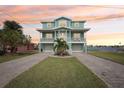 Two-story home with double garage and paved driveway at 339 55Th Ave, St Pete Beach, FL 33706