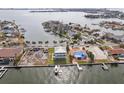Aerial view of waterfront homes and properties with boat slips at 339 55Th Ave, St Pete Beach, FL 33706