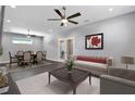 Spacious living room with dining area and modern furniture at 8448 Red Roe Dr, New Port Richey, FL 34653
