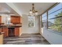 Bright dining area with wood flooring and large windows at 2699 Seville Blvd # 303, Clearwater, FL 33764