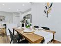 Dining area with a wooden table and black chairs at 517 Madeira St, Port Charlotte, FL 33953