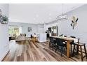 Open concept kitchen and dining area with modern appliances and island at 517 Madeira St, Port Charlotte, FL 33953