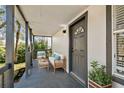 Inviting front porch features comfortable seating and potted plants at 1106 W La Salle St, Tampa, FL 33607
