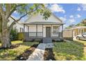 Charming renovated bungalow with a front porch and landscaped yard at 1106 W La Salle St, Tampa, FL 33607