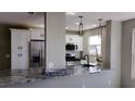 Modern kitchen features granite countertops and stainless steel appliances at 5623 80Th St N # 510, St Petersburg, FL 33709