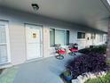 Bright and airy front porch with seating area at 2460 Persian Dr # 6, Clearwater, FL 33763