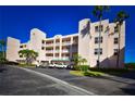 Condo building exterior showcasing ample parking at 6575 99Th N Way # 22201, St Petersburg, FL 33708