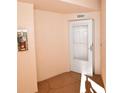 Condo entry with a white door and neutral walls at 6575 99Th N Way # 22201, St Petersburg, FL 33708