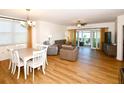 Bright living room with dining area and access to a balcony at 6575 99Th N Way # 22201, St Petersburg, FL 33708