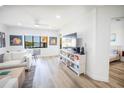 Bright living room with water views, comfy sofas and large TV at 1515 Pinellas Bayway S # B28, Tierra Verde, FL 33715