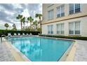 Refreshing swimming pool with ample deck space for lounging at 701 Mirror Lake N Dr # 309, St Petersburg, FL 33701