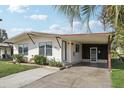 Single story home with covered carport and landscaping at 3121 Briar St, Wesley Chapel, FL 33543