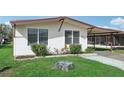 Single story home with covered carport and landscaping at 3121 Briar St, Wesley Chapel, FL 33543