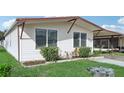 Single story home with covered carport and landscaping at 3121 Briar St, Wesley Chapel, FL 33543