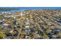 An aerial view showcasing the neighborhood with the ocean in the background at 1786 Nevada Ne Ave, St Petersburg, FL 33703