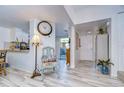 Bright living room with light flooring and a comfy chair at 110 Woods Landing Trl, Oldsmar, FL 34677