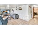 Sunroom with tiled floors and access to the dining room at 506 Lime Tree Ct, Sun City Center, FL 33573