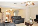 Inviting living room featuring tile floors, a ceiling fan, and comfortable seating, perfect for relaxation at 117 114Th N Ave # 117, St Petersburg, FL 33716