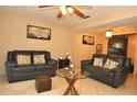 Living room with two sofas and a glass coffee table at 117 114Th N Ave # 117, St Petersburg, FL 33716