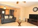 Spacious living room with tiled floors and two sofas at 117 114Th N Ave # 117, St Petersburg, FL 33716