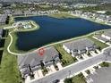 Aerial view showing townhouses near a lake at 928 Royal Empress Dr, Ruskin, FL 33570