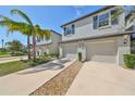 Two-story townhouses with attached garages and landscaping at 928 Royal Empress Dr, Ruskin, FL 33570