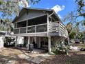 Two-story house with a large deck and screened porch at 7418 Seagull Way, Tampa, FL 33635