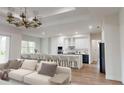Open concept kitchen and living area with modern appliances and island at 4716 Hickory Oak Dr, Brooksville, FL 34601