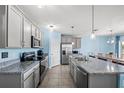 Modern kitchen with stainless steel appliances and granite countertops at 15502 Black Pepper Ln, Odessa, FL 33556