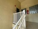 Building entrance with white railings and unit number 201 at 6007 Skydale Way # 201, Riverview, FL 33578