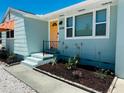 Front view of a renovated teal home with orange accents at 2658 48Th S St, Gulfport, FL 33711